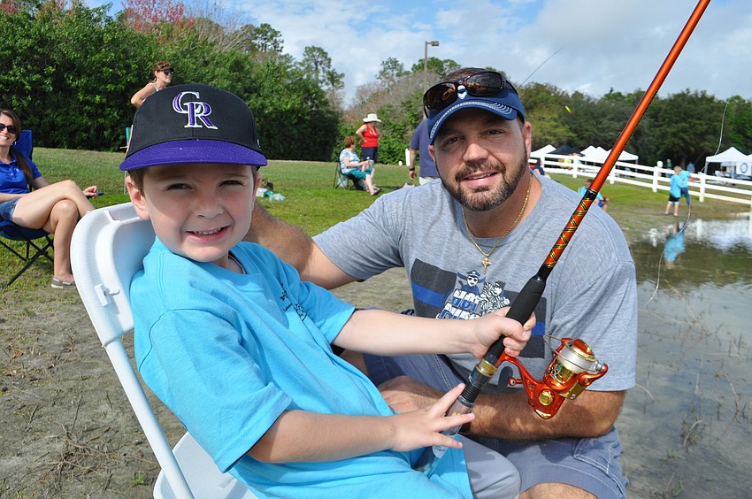 Lewis Panico fishes with his dad, Brian, and mom, Amanda, not pictured.