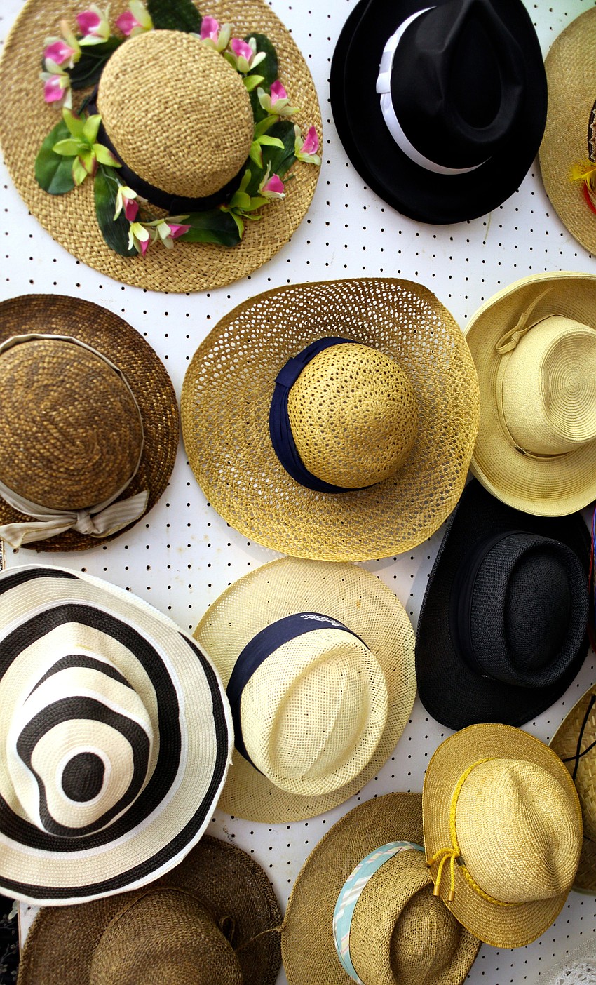 Sunhats hang by the entryway with the other accessories.