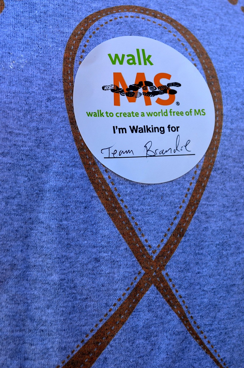 Participants wore stickers showing the name of a loved one with MS, to whom they dedicated the walk.