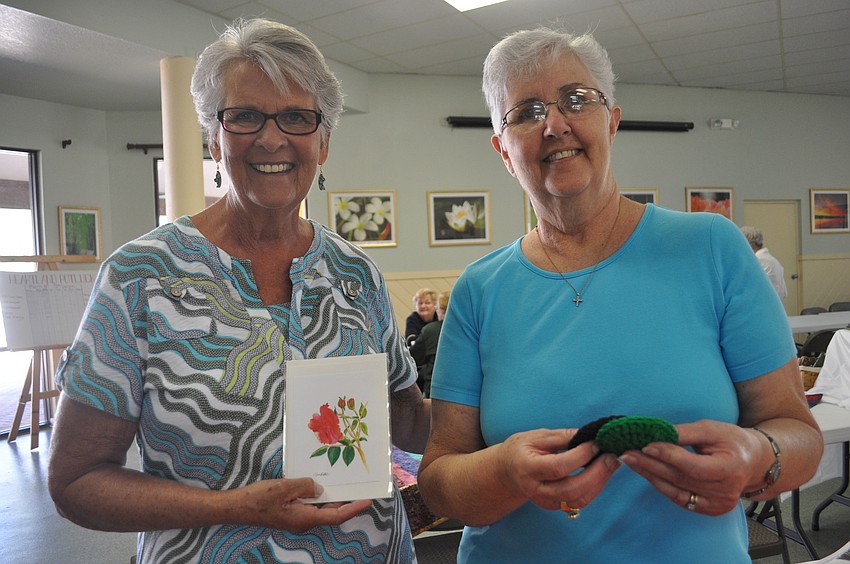 Julie Sanders, who purchased letters, with Gean Miller, a crochet artist.