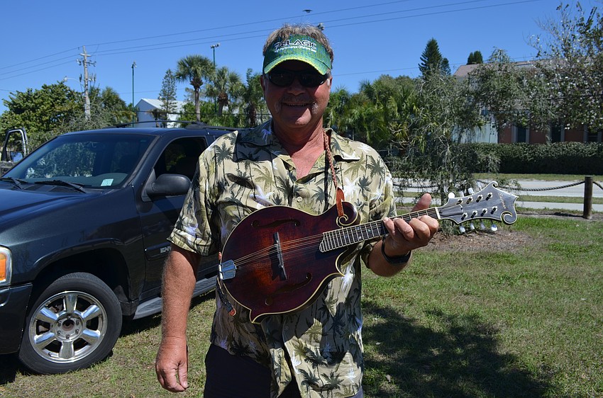Danny Beach, from the Siesta Key Band, has been playing the mandolin for 20 years.