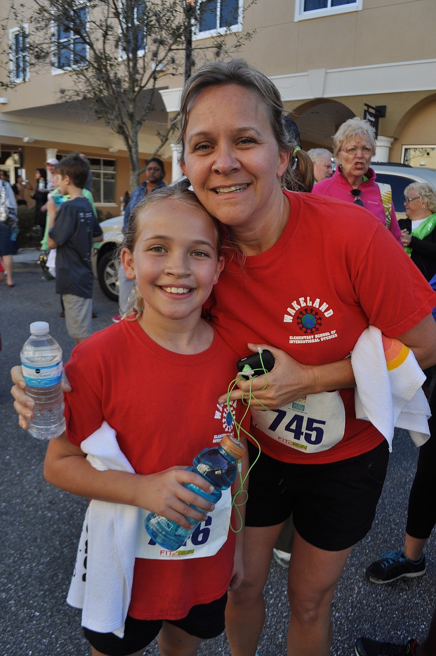 Kim and Mallory Stroud, of Mill Creek, run the whole race together.