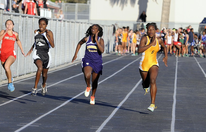 Sarasota sprinter Renecia Hall races down the home stretch of the 100-meter dash.