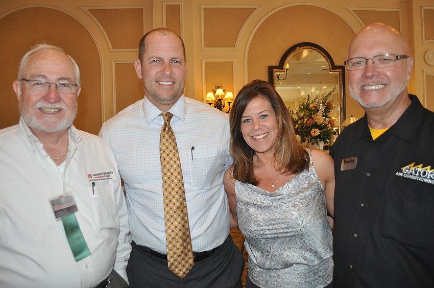 John Hubbard of Custom Security and Electronics, Dennis Woodruff and Rachel House of SRT International Realty and Mike Wilk of Gator Air Conditioning