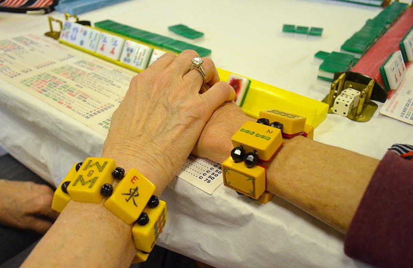 Gloria Bakal and Susan Landau wear their lucky mahjong bracelets for the event.