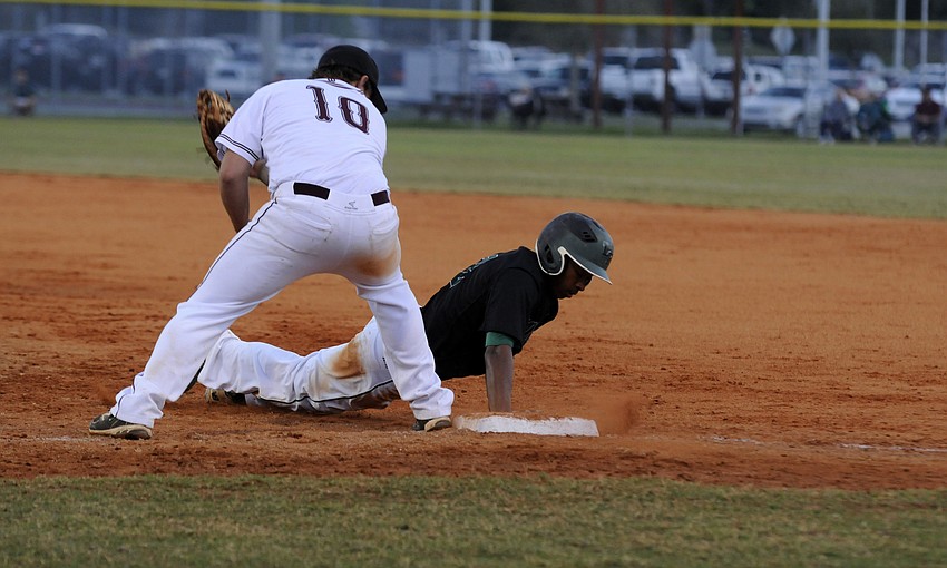 Lakewood Ranchâ€™s Cameron Pearcey beats the throw back to first base.