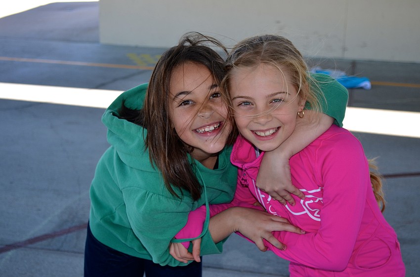 Nine-year-olds Jade Fisher and Hennessy Luciano enjoy some girl time.