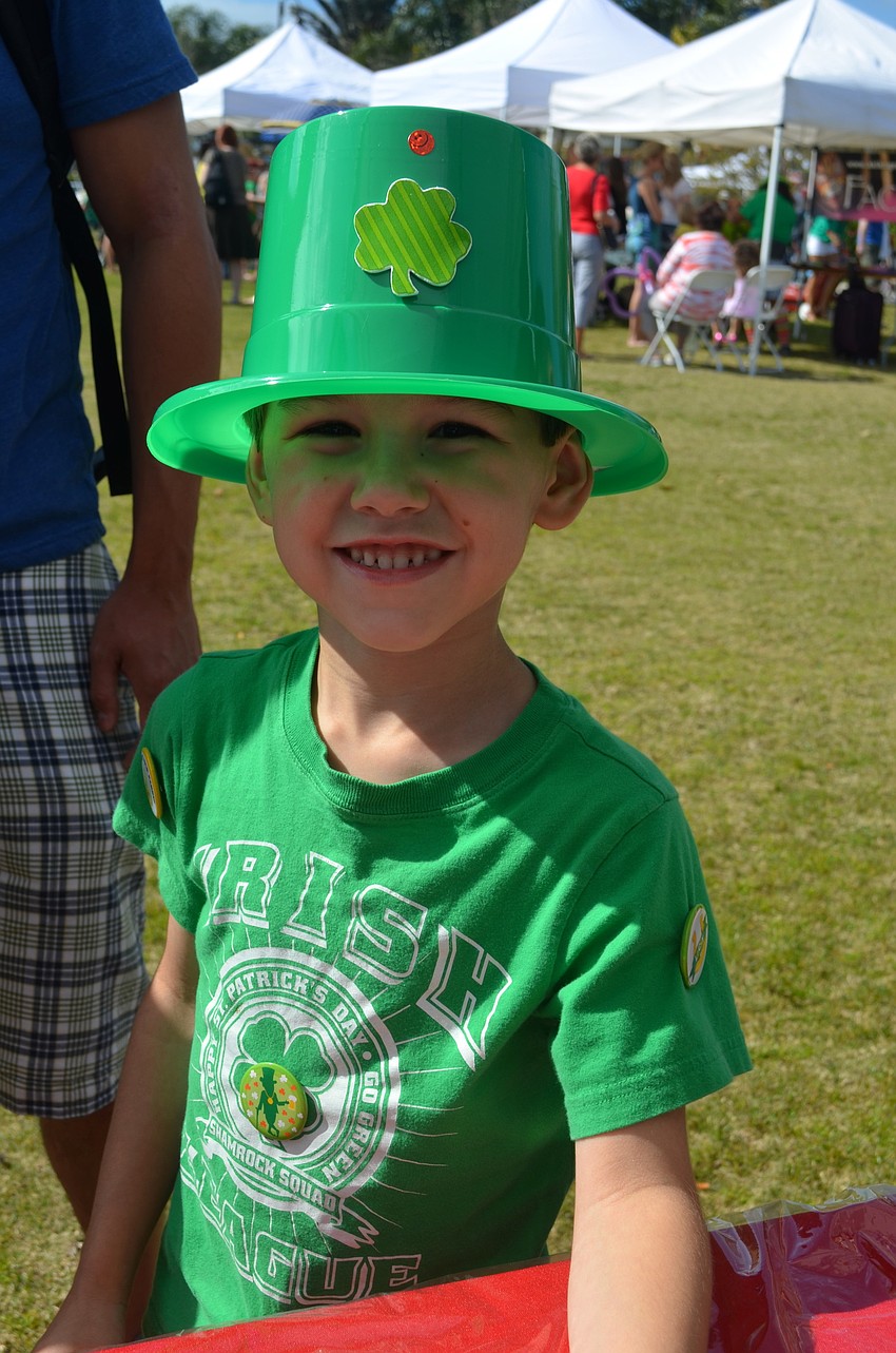 Dylan Henry, 6, decorates a hat for the festival.