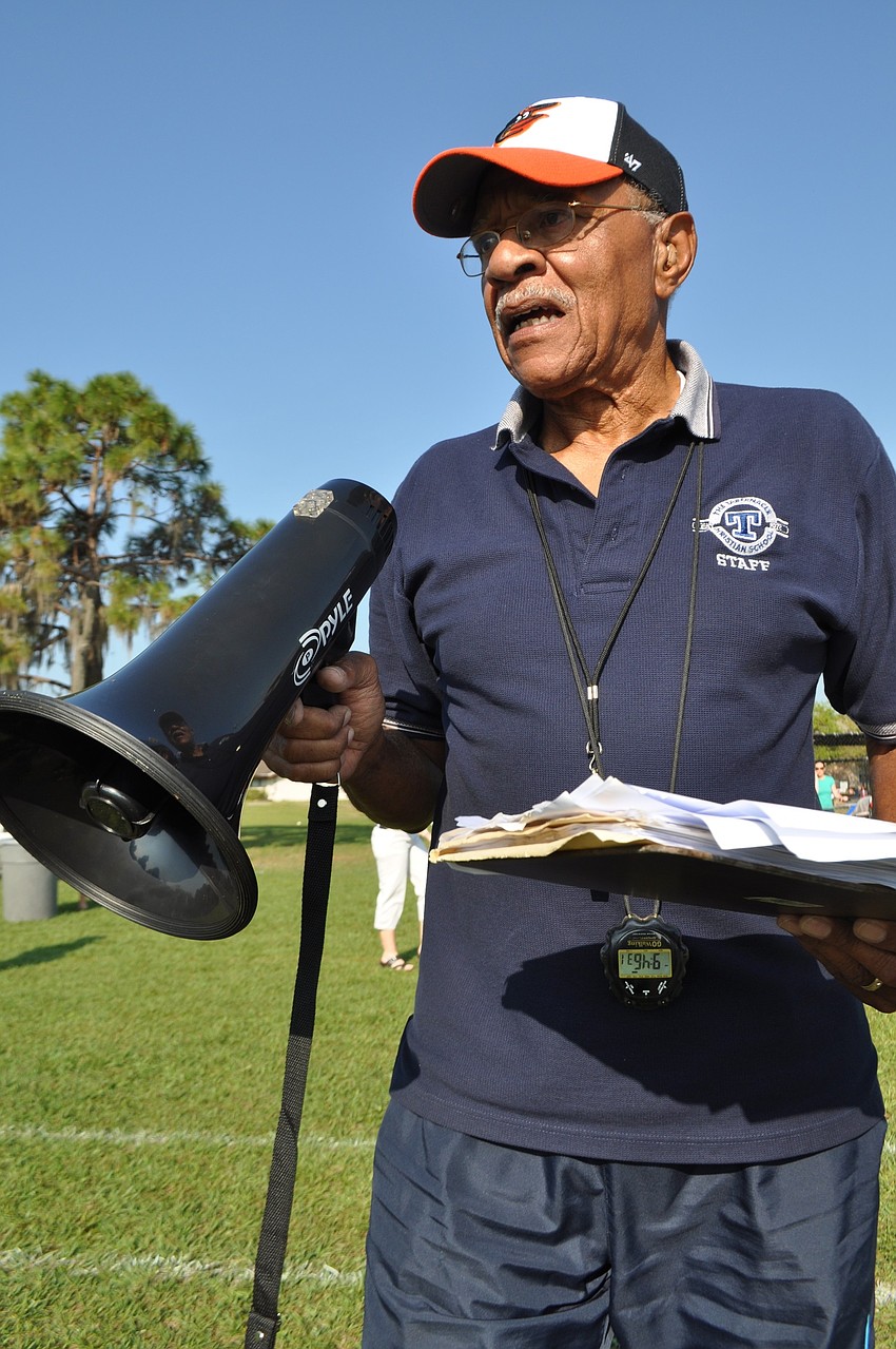 oach Worth Waters assigns racers their track lane.