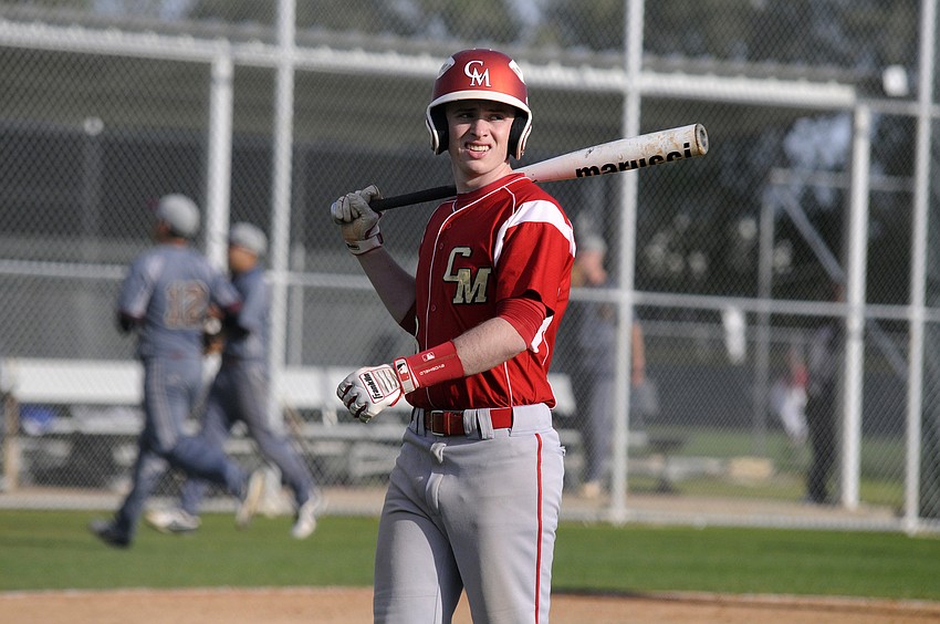 Cardinal Mooney senior Robby Shay heads back to the dugout after hitting a fly ball.