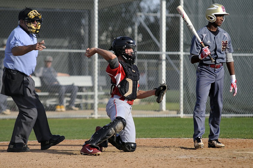 Cardinal Mooney senior catcher Matt Quinlan throws the ball back to the mound.