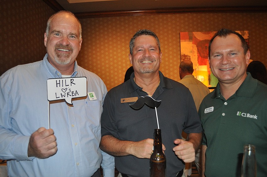 Rob Ferguson of Holiday Inn Lakewood Ranch, Joe Talerico of Bankers Life and Casualty Company and Michael Talerico of C1 Bank