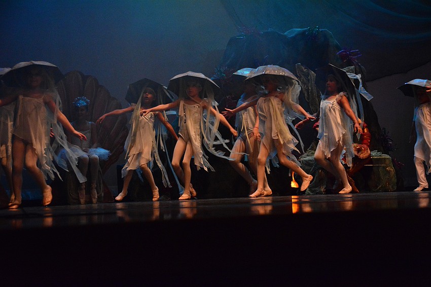 A school of jellyfish run across the stage.