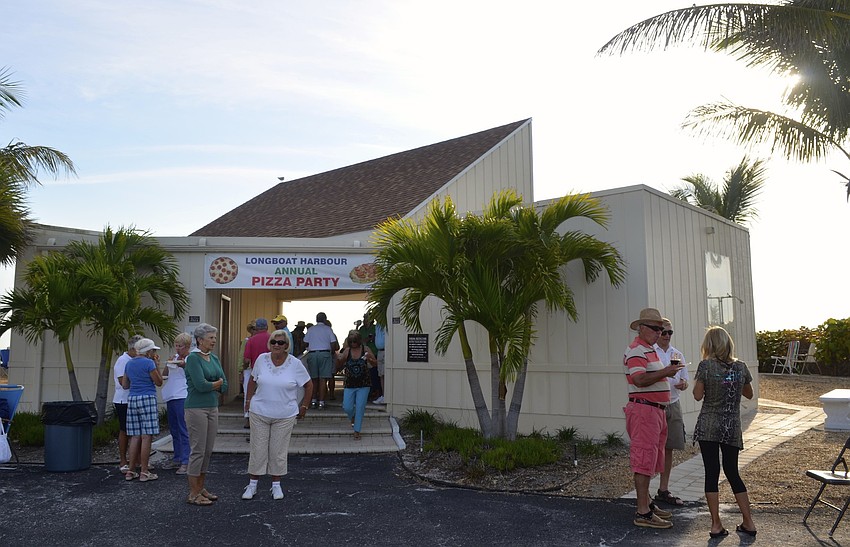 The pizza party is held each year at Longboat Harbourâ€™s beach house.