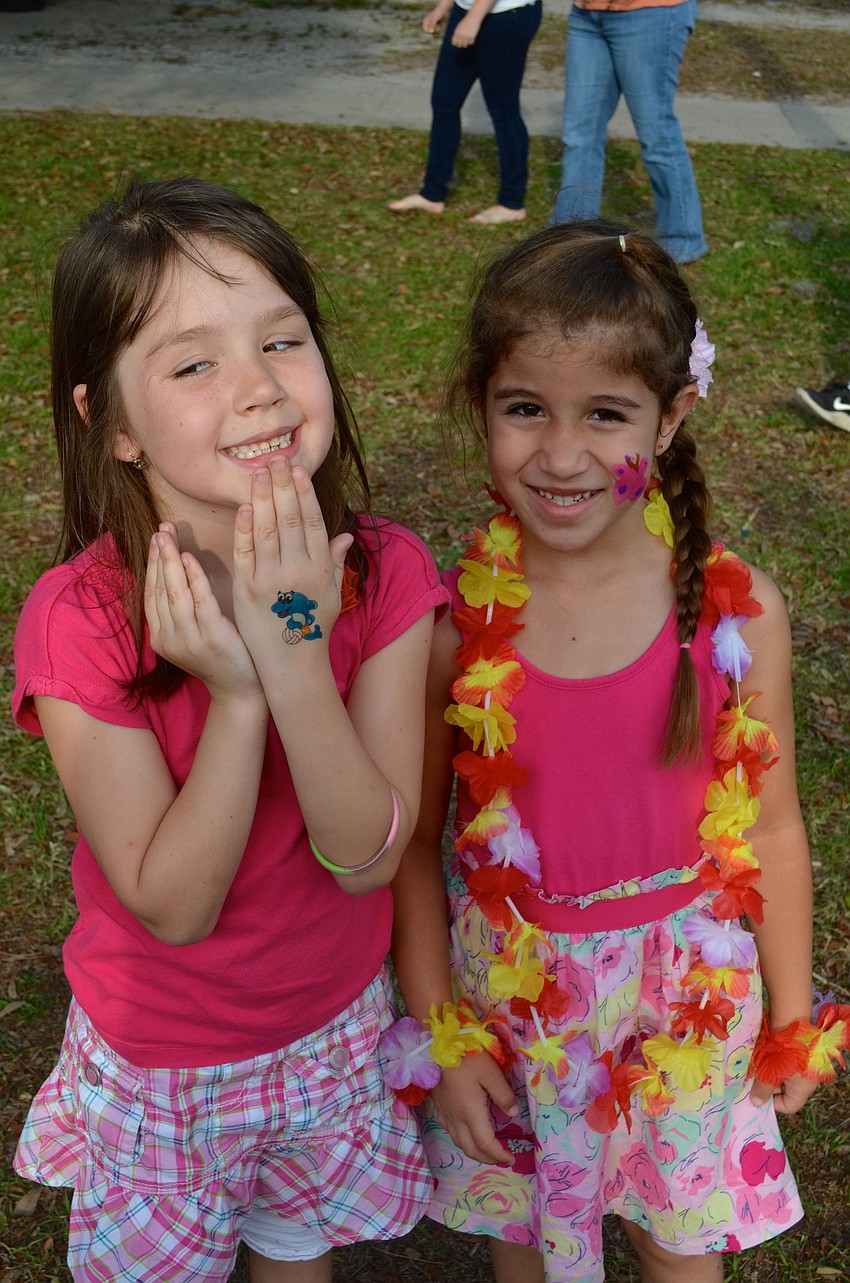 Best friends Jessica Dolan and Isabella Oliveira take a break from chasing each other.