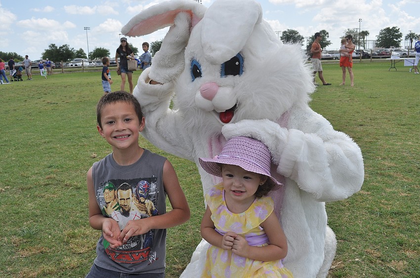 Zachary Moyano and Allesandra Burges pose with the Easter bunny.