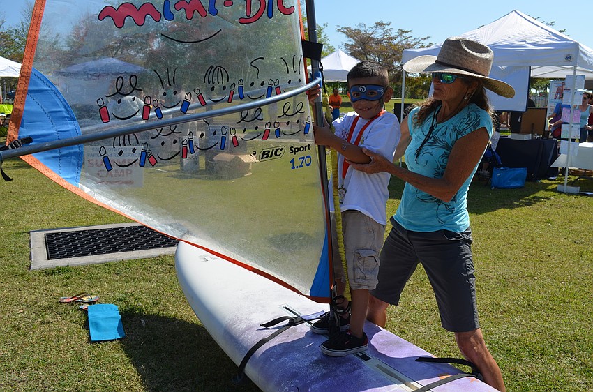 Michael Catalan leans how to windsurf.