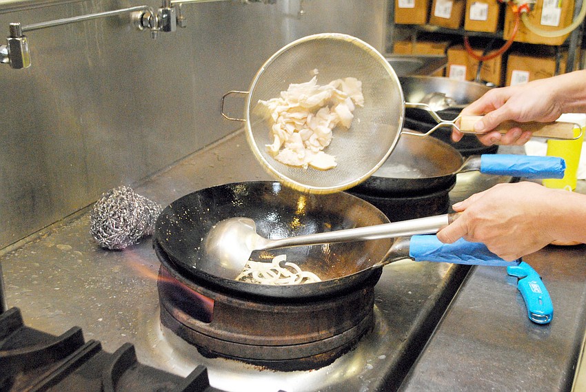 Chef Lam Lum prepares Koor Mee Lao