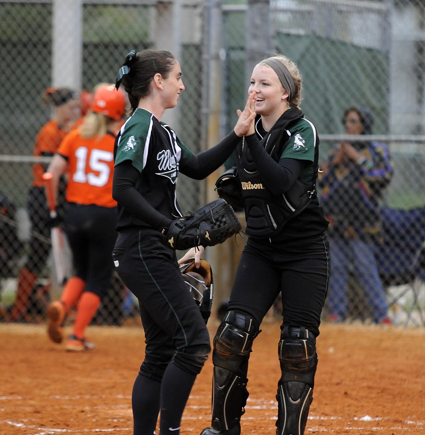 Lakewood Ranch pitcher Logan Newton and catcher Talli Sharp celebrate after holding Sarasota scoreless in the first inning.