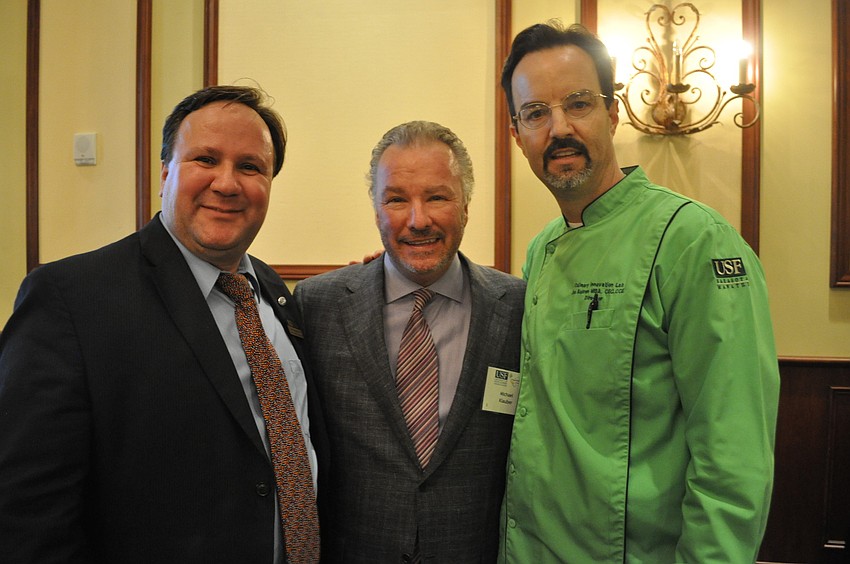 Cihan Cobanoglu, dean of the College of Hospitality and Technology Leadership at USFSM, with restaurateur Michael Klauber and Joe Askren, the director of the USFSM Culinary Innovation Lab