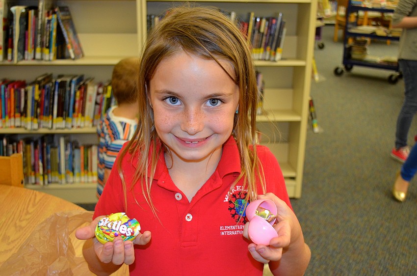 Throughout the evening, Makenzie Vonborstel gave away Easter eggs she found.