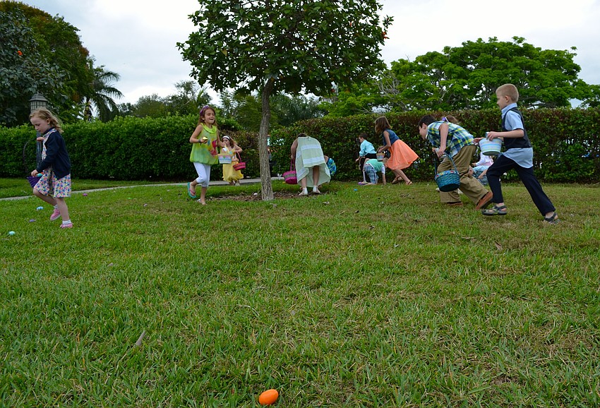 Children hunt for eggs filled with sweets.