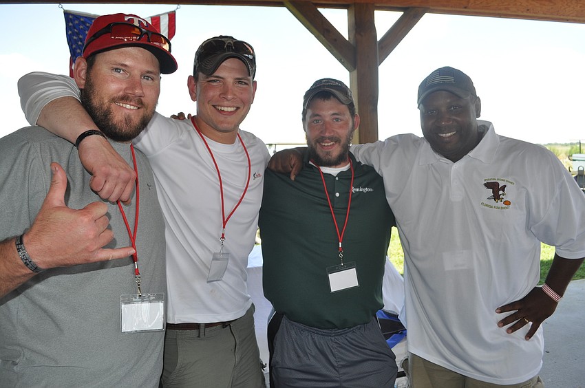 Lee Sage, a retired specialist in the Army, Jon Carnes, Rex Tharp and Denny Phillips