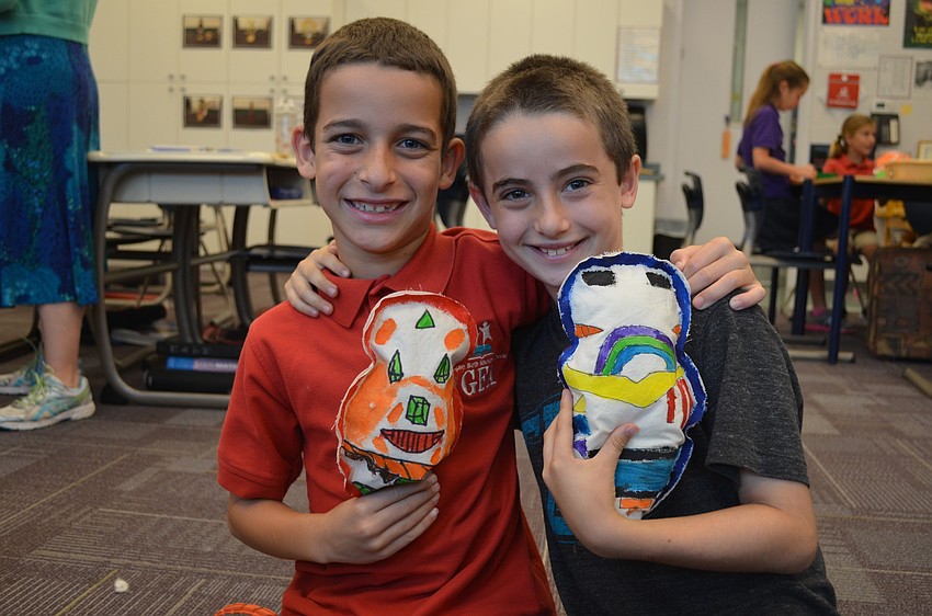 Jack Guttman and Ben Sheriff with their dolls.