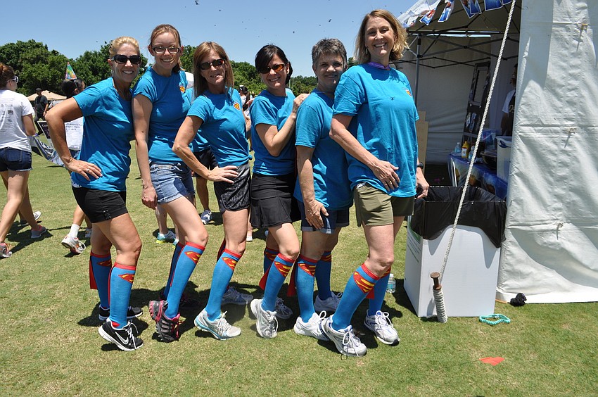 Team Hautamaki & Horiuchi members Sharon Schwalm, Emma Schotall, Susan Ward, Pinar Nomer, Jackie Boucher and Caroline Joslin show off their Superman socks.