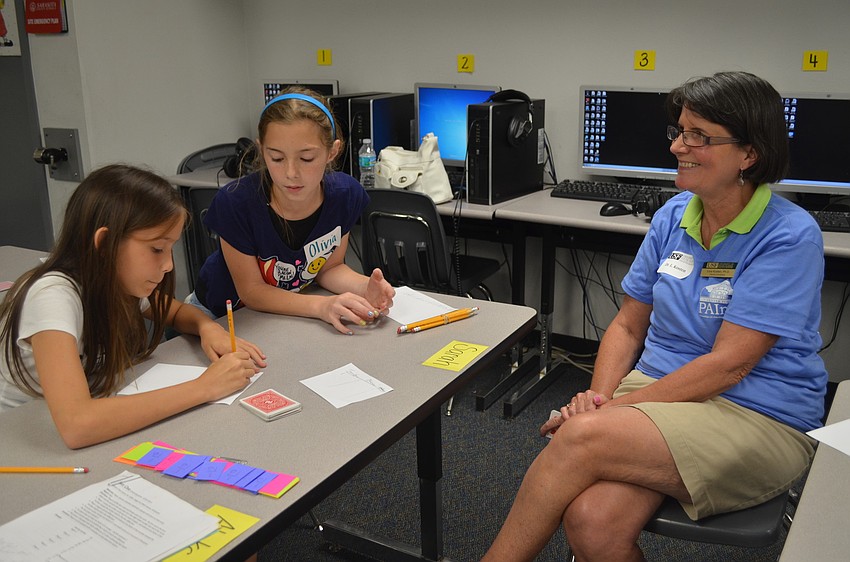 Jennifer Lamb and Olivia Miley with volunteer Lora Kosten