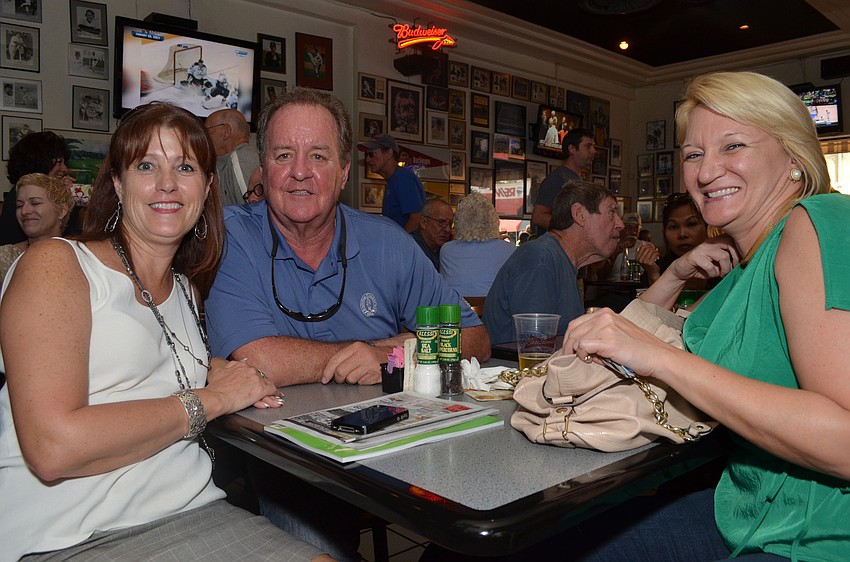 Longboat Key Chamber members Tammy Halsted, Bob Walker and Dawn Mims