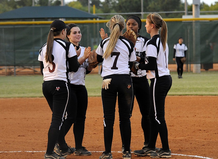 The Braden River High infield celebrates a strikeout in the bottom of the fifth inning.