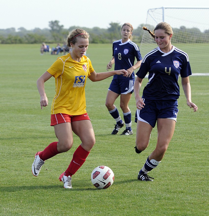 Clearwater Chargers Elite forward Kassidee Davis maneuvers the ball around a West Side Lady Eagles defender.