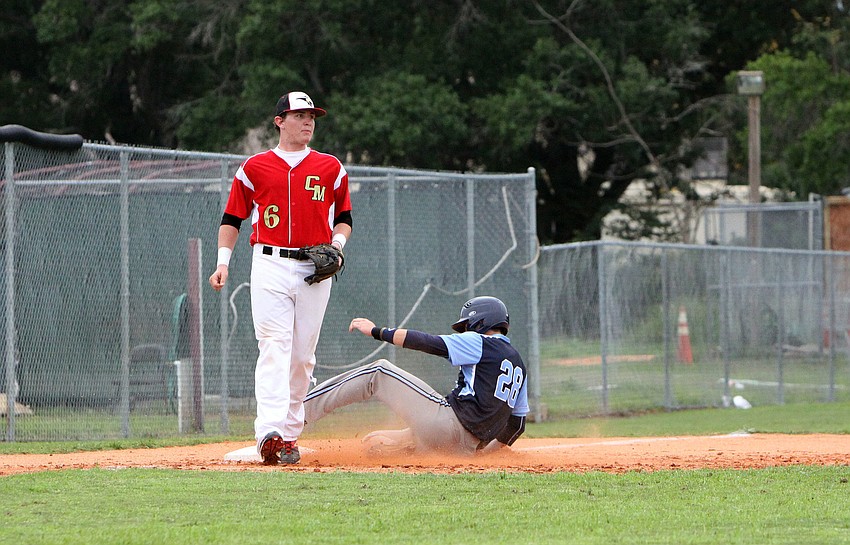 Out-of-Door Academyâ€™s Tyler Dietrich, No. 28, slides into third.