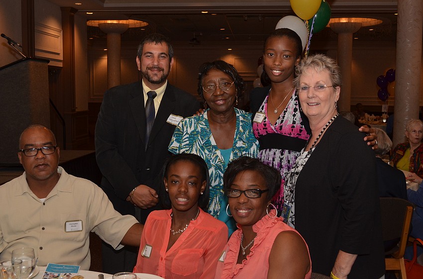(seated ) Christopher Moona, his daughter KaylaWilkins,  and his wife Cynthia Devaux â€“ Moona, (standing ) Booker High School Assistant Principal Josh Leinweber, Pearlene Stephens her daughter Cassandra and Beverly Porter