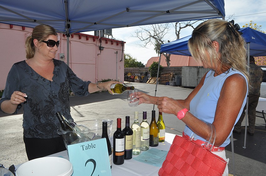 Jen Foye serves Diane Cook a Chilean Chardonnay