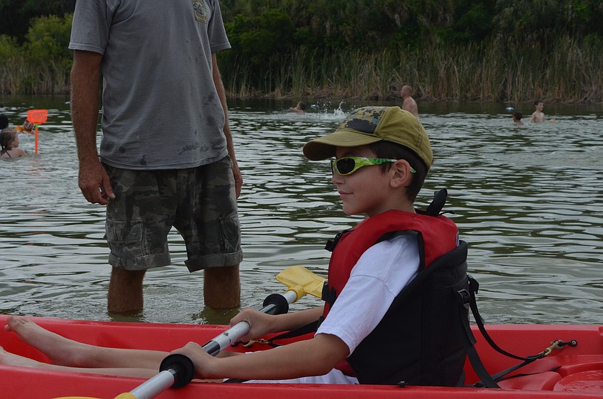 Mason Rohling gets ready to try out a kayak with Silent Sport Outfitters.