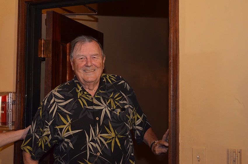 Paul Thorpe walks into a room full of 120 people for his surprise party.