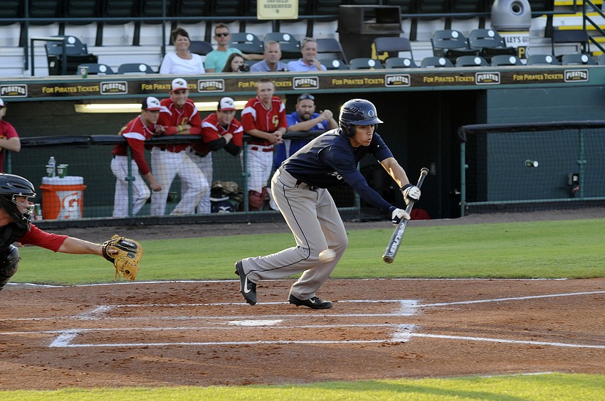 ODA sophomore Jake Romine attempts a bunt in the top of the first inning.