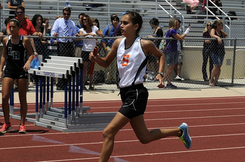 Sarasotaâ€™s Angelina Grebe heads into the second lap of her leg of the 4x800 relay.