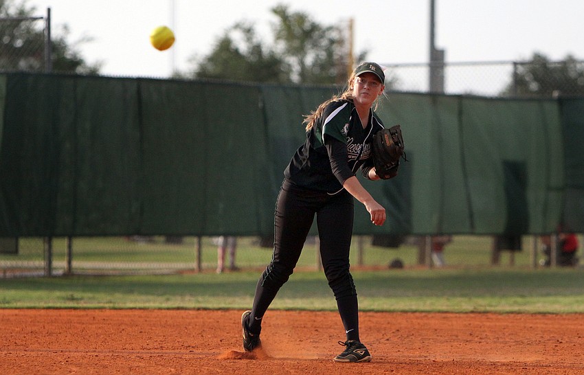 Lakewood Ranchâ€™s McKaleigh Goodale, No. 12, throws the ball towards first base.