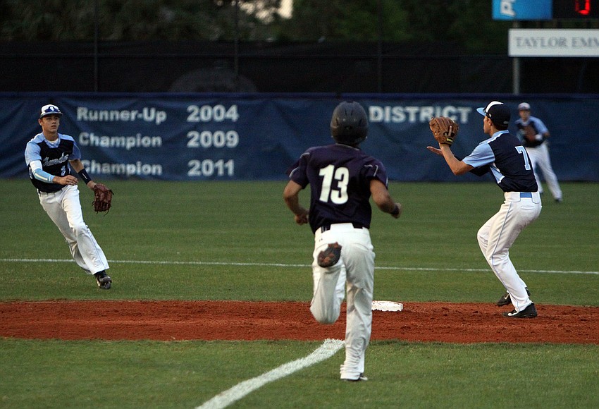 Out-of-Door Academyâ€™s Jimmy Kuebler, No. 2, threw the ball to teammate Jake Romine, No. 7, in time to get out Christian Calvaryâ€™s Luis Lopez, No. 13, at second base.