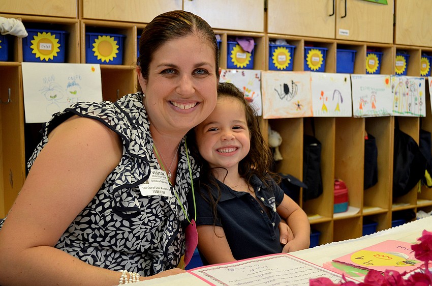 Christine sits with her daughter, Madison.