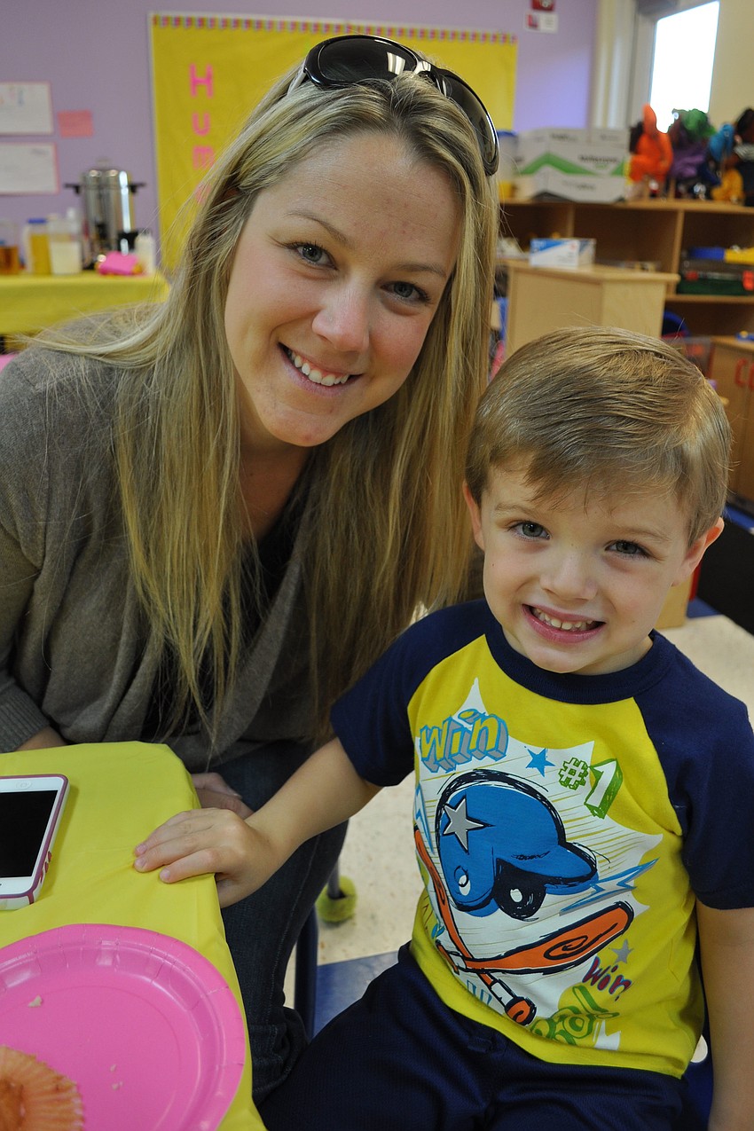 Vicki Randenburg and her 3-year-old son Jaden, of Kiddie Academy, love blueberry muffins.