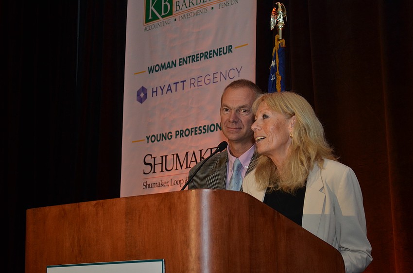 Gabriele Charity and Rudy Weiss are honored with the International Business Award and express their gratitude.