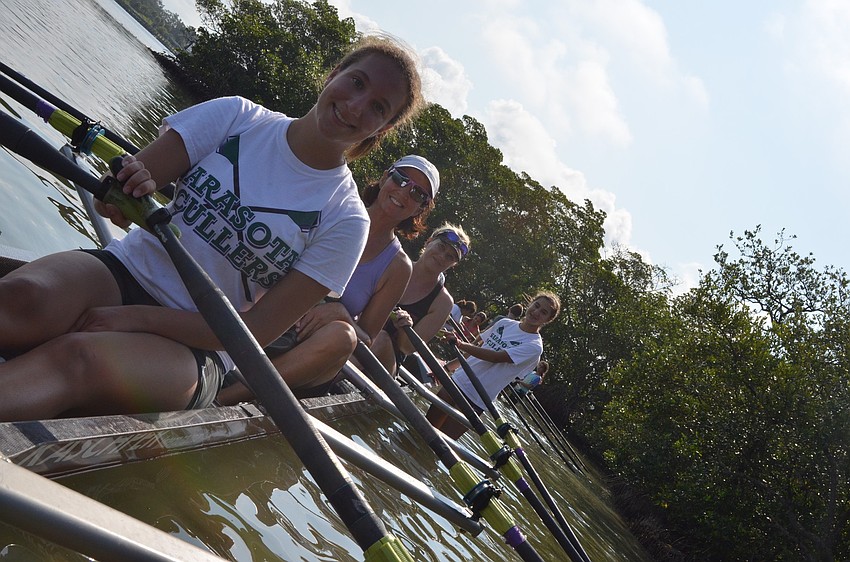 Summer Strickland and her mother Susan get ready to row out with Halle Ghose and her daughter Cecilia.
