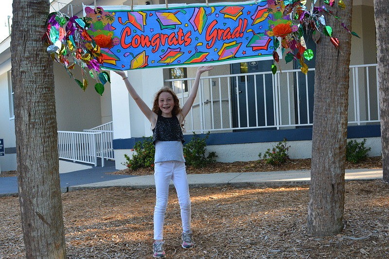 Hannah W. crosses the mulch.