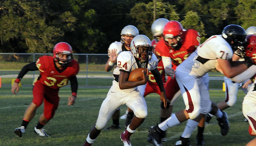 Braden River running back Carlos Crawford runs for a 27-yard gain to close out the first half.