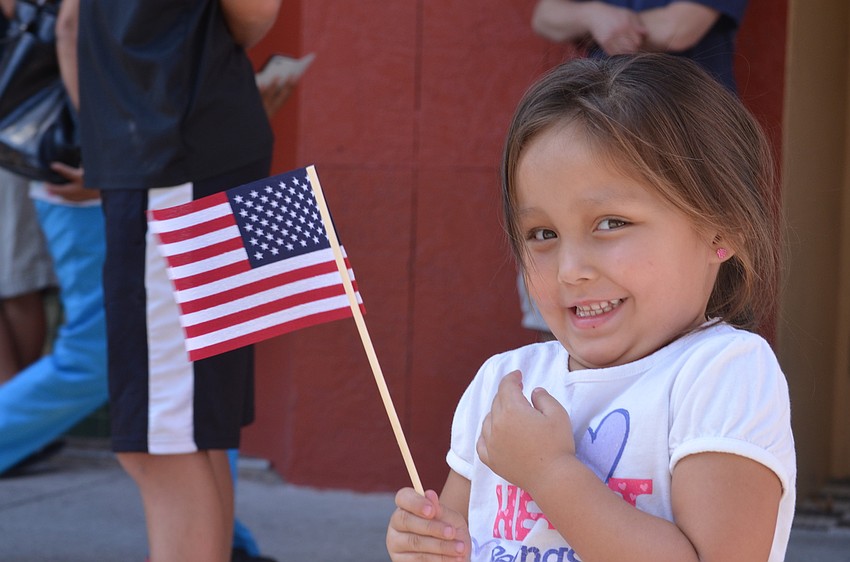 Ariela Castaneda, 3, proudly waved her flag.