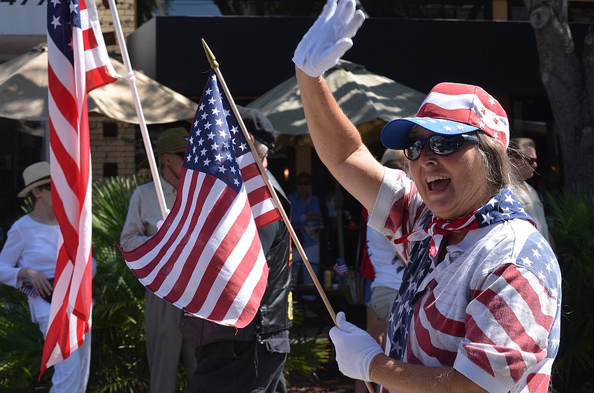 Linda Watkins showed her patriotism by walking in the parade with the Vietnam Brotherhood.